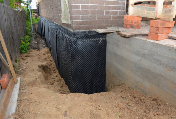 Happy homeowners after waterproofing job in Kaukauna